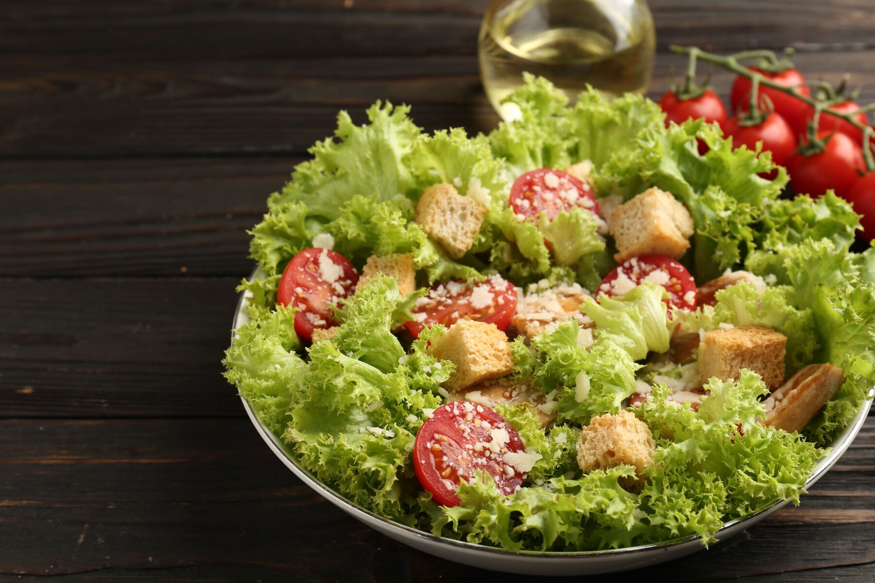 Classic house salad with fresh greens, tomatoes, cucumber, red onion and carrot