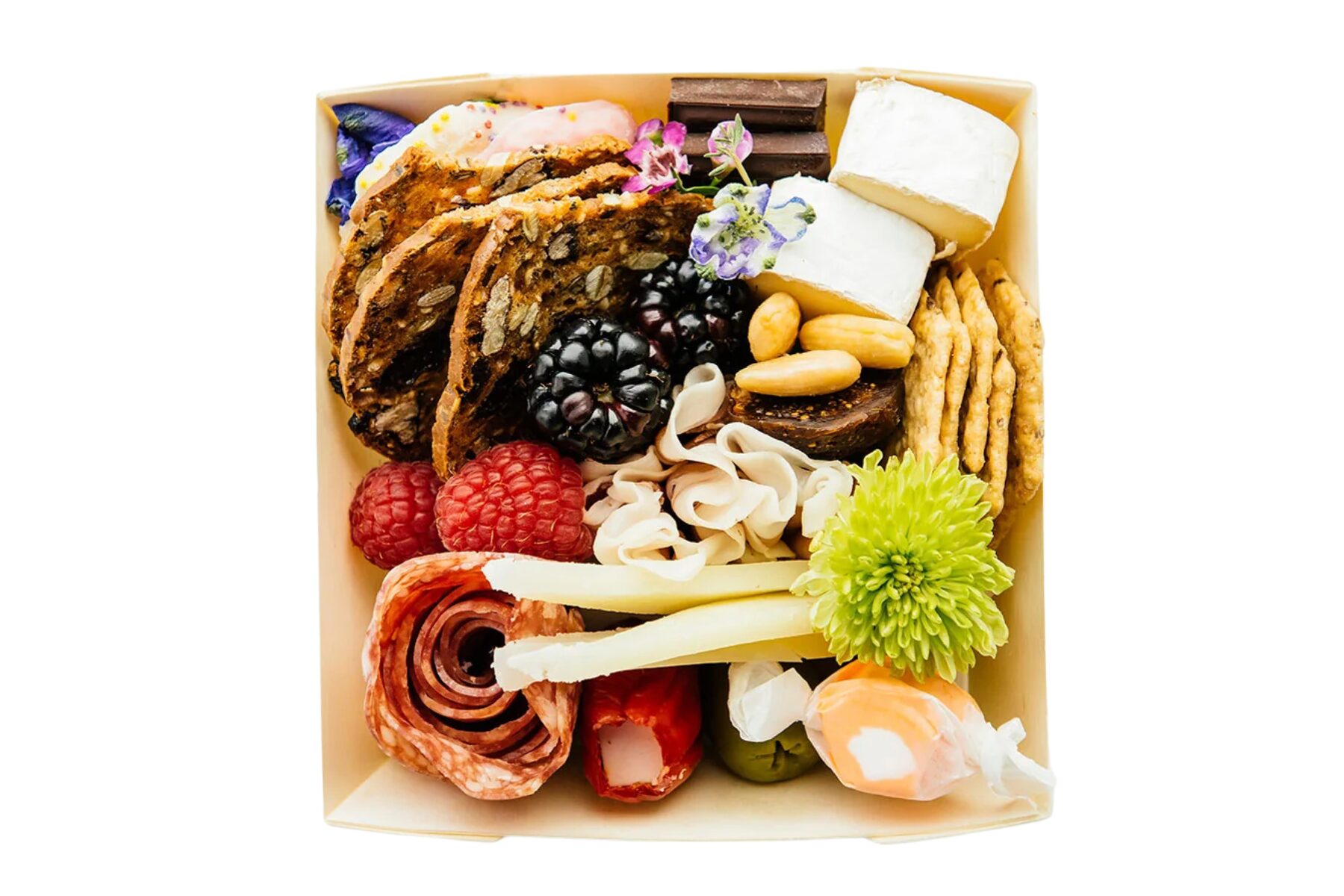 Charcuterie mini boxes filled with artisan cheeses, meats, olives, nuts and fruit